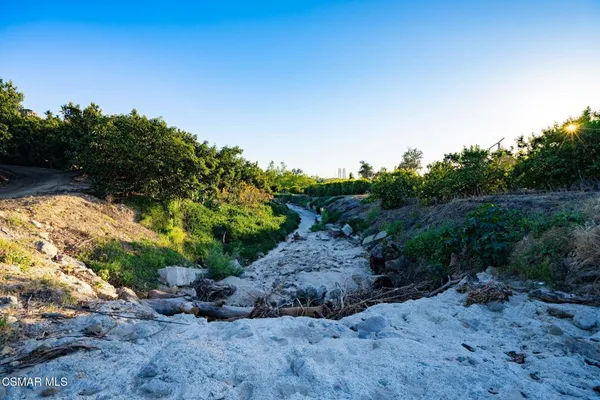 a view of a city with mountains in the background