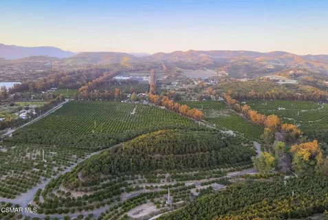 a view of a town with mountains in the background