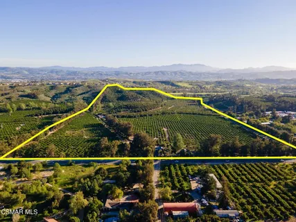 an aerial view of mountain with lake view