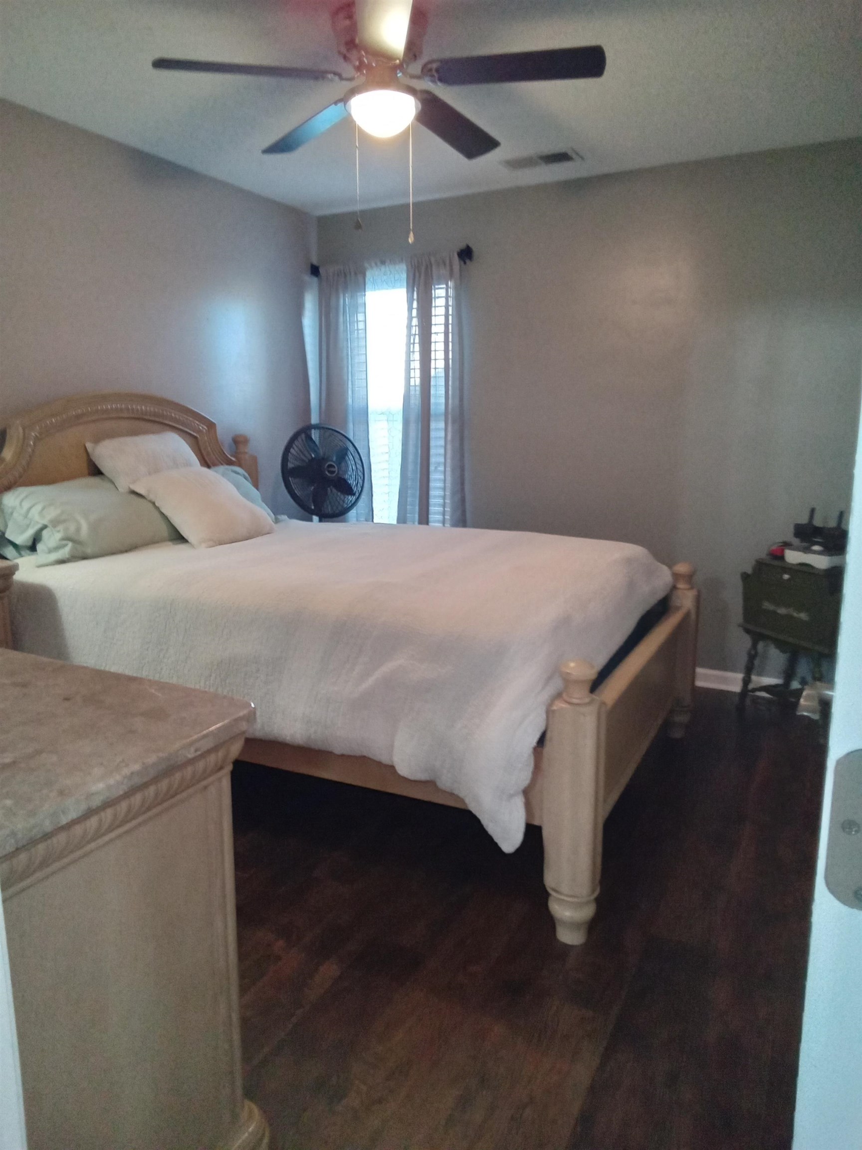 6907 Manslick Road Cordova, TN 38018 - Photo 12 of 24 Bedroom featuring dark wood finished floors and a ceiling fan