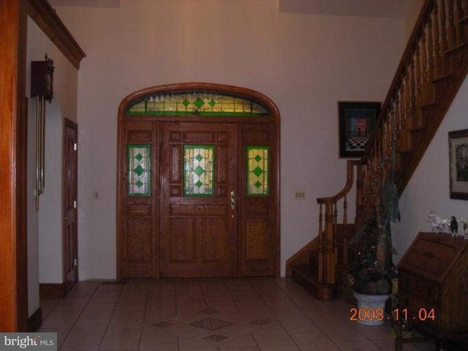 7950 Estevez Road La Plata, MD 20646 - Photo 14 of 30 Large foyer w/ stained glass custom door