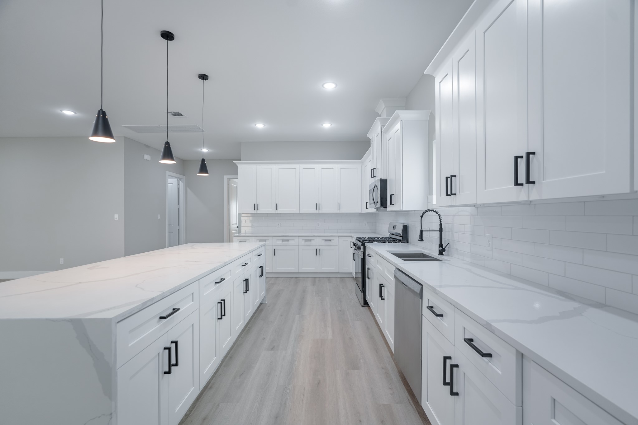 2618 Piemonte Avenue Cir Spring Spring, TX 77388 - Photo 18 of 50 a kitchen with white cabinets appliances and sink
