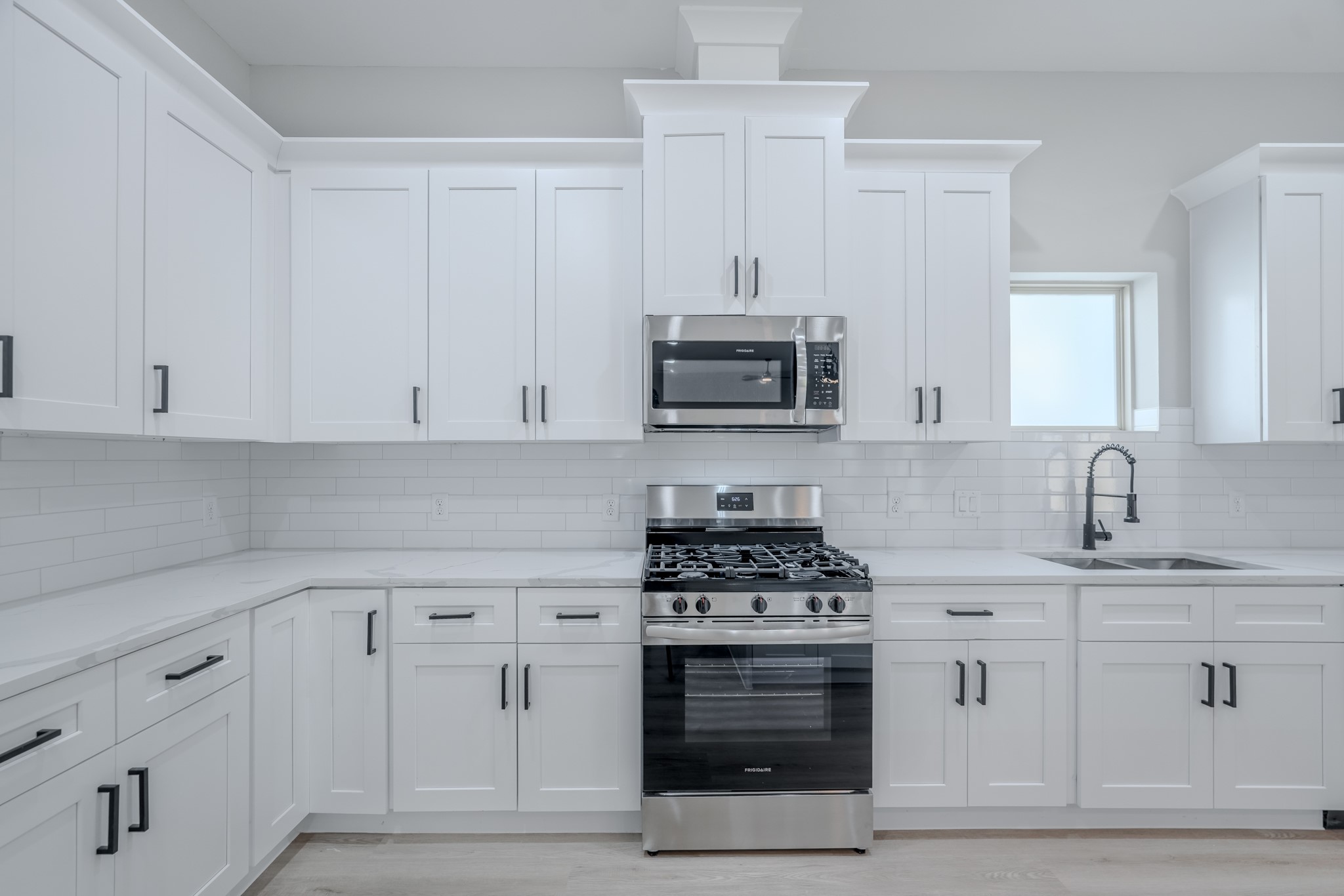 2618 Piemonte Avenue Cir Spring Spring, TX 77388 - Photo 20 of 50 a kitchen with white cabinets and appliances