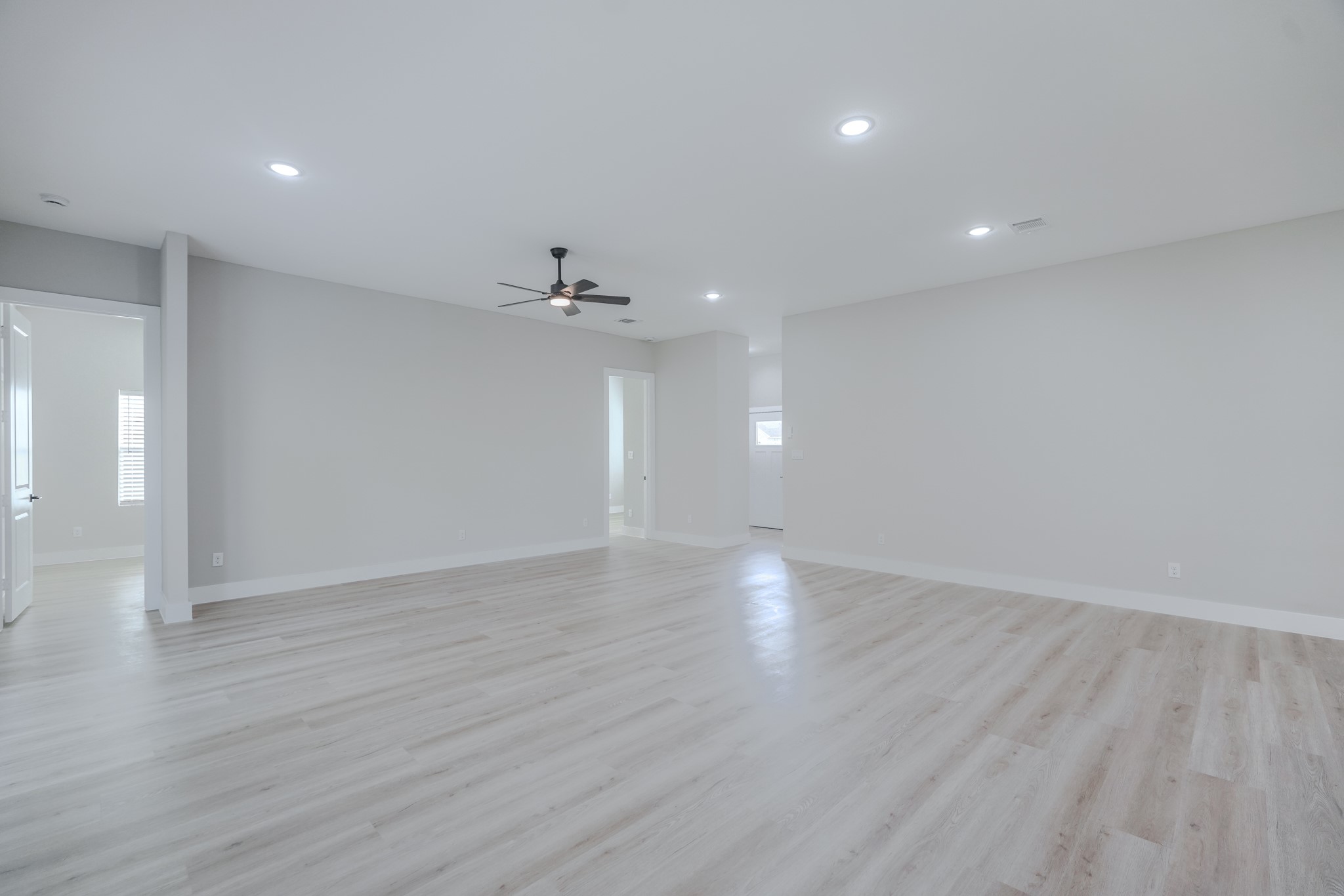 2618 Piemonte Avenue Cir Spring Spring, TX 77388 - Photo 9 of 50 a view of an empty room with wooden floor and chandelier