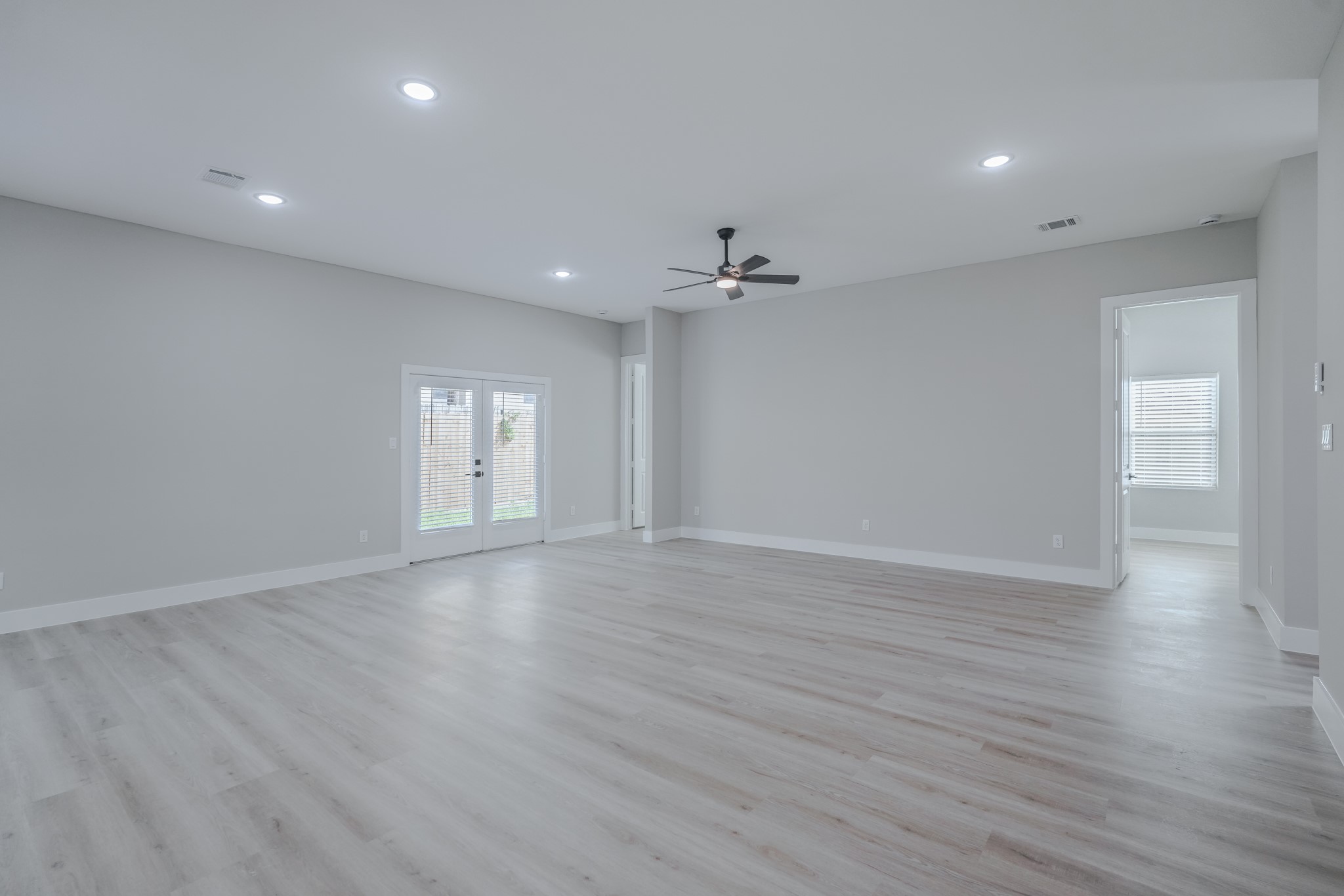 2618 Piemonte Avenue Cir Spring Spring, TX 77388 - Photo 10 of 50 a view of an empty room with wooden floor and window