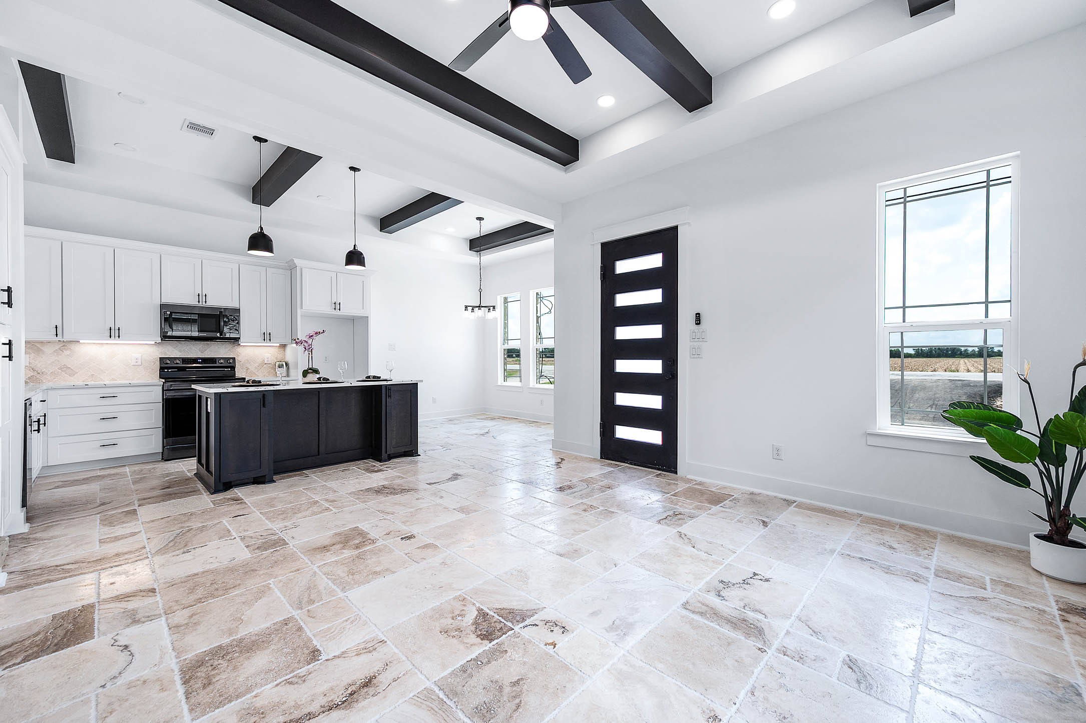 14120 Fm1236 Road Needville, TX 77461 - Photo 11 of 34 a large kitchen with stainless steel appliances kitchen island granite countertop a refrigerator and a stove top oven