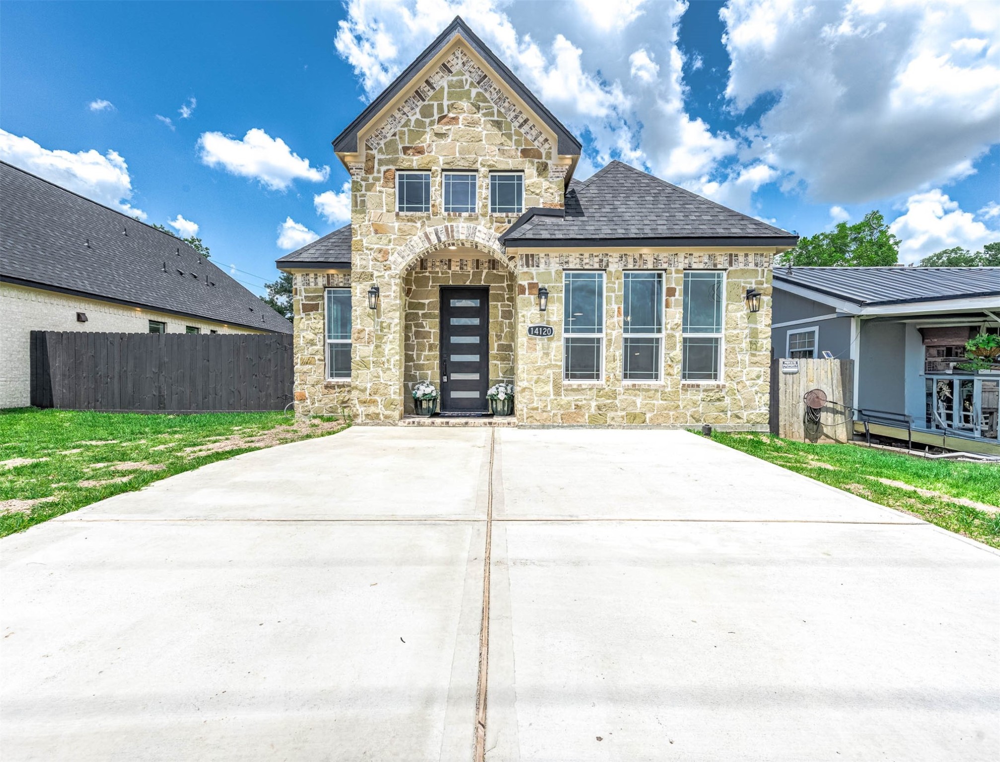 14120 Fm1236 Road Needville, TX 77461 - Photo 2 of 34 a front view of a house with a yard and garage