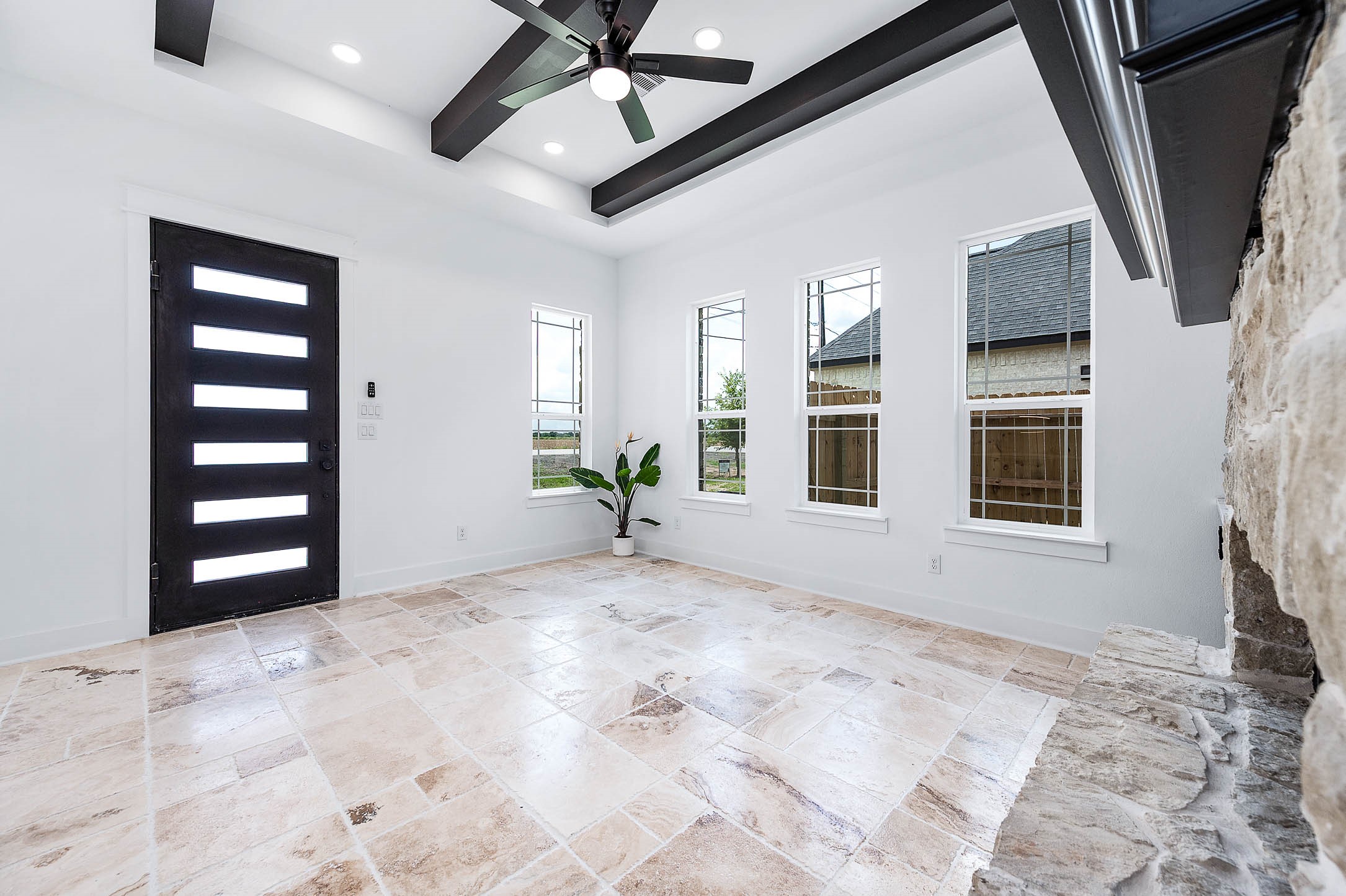 14120 Fm1236 Road Needville, TX 77461 - Photo 9 of 34 a view of an empty room with a window and kitchen view