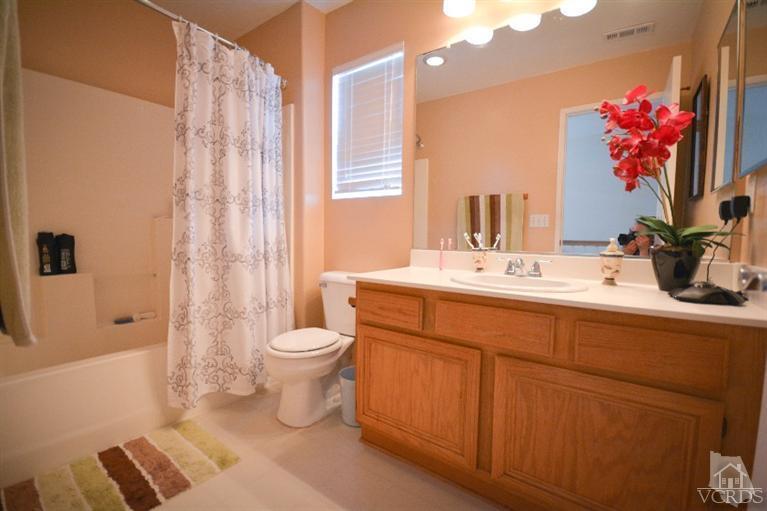 843 Pivot Point Way Oxnard, CA 93035 - Photo 13 of 21 a bathroom with a sink a toilet and shower