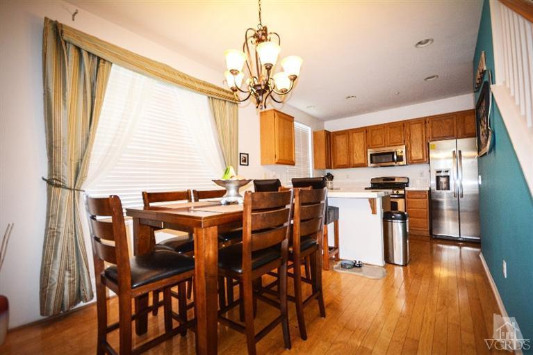 843 Pivot Point Way Oxnard, CA 93035 - Photo 3 of 21 a view of a dining room with furniture window and wooden floor