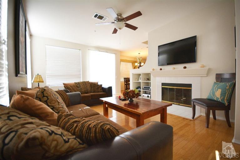 843 Pivot Point Way Oxnard, CA 93035 - Photo 5 of 21 a living room with furniture fireplace and a flat screen tv