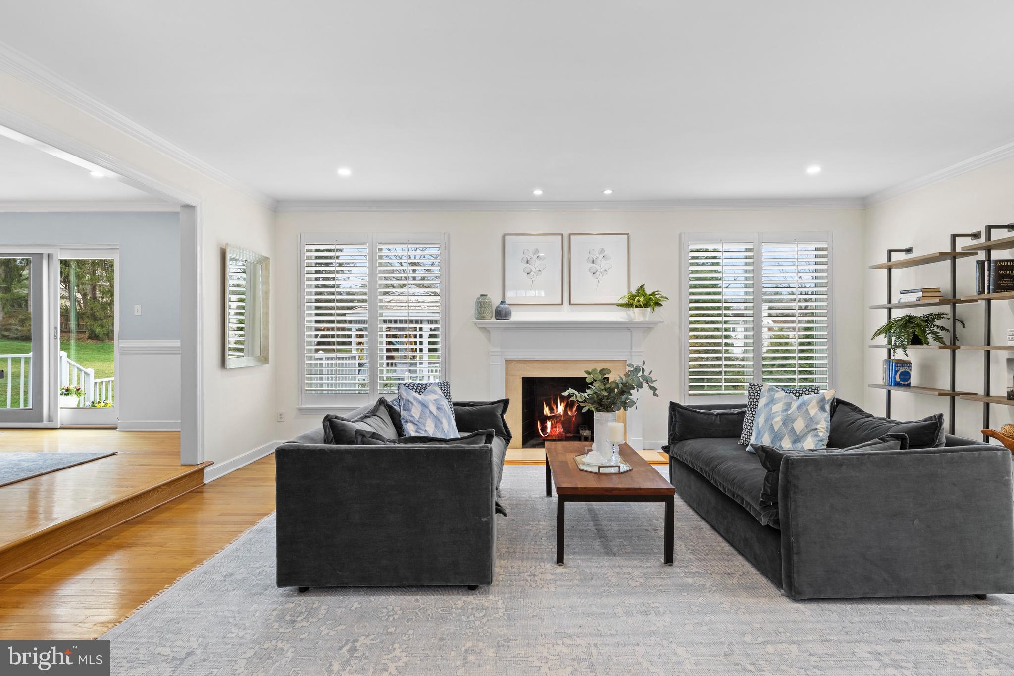 217 Ravenscliff Road Wayne, PA 19087 - Photo 19 of 64 Living room with fireplace and large windows