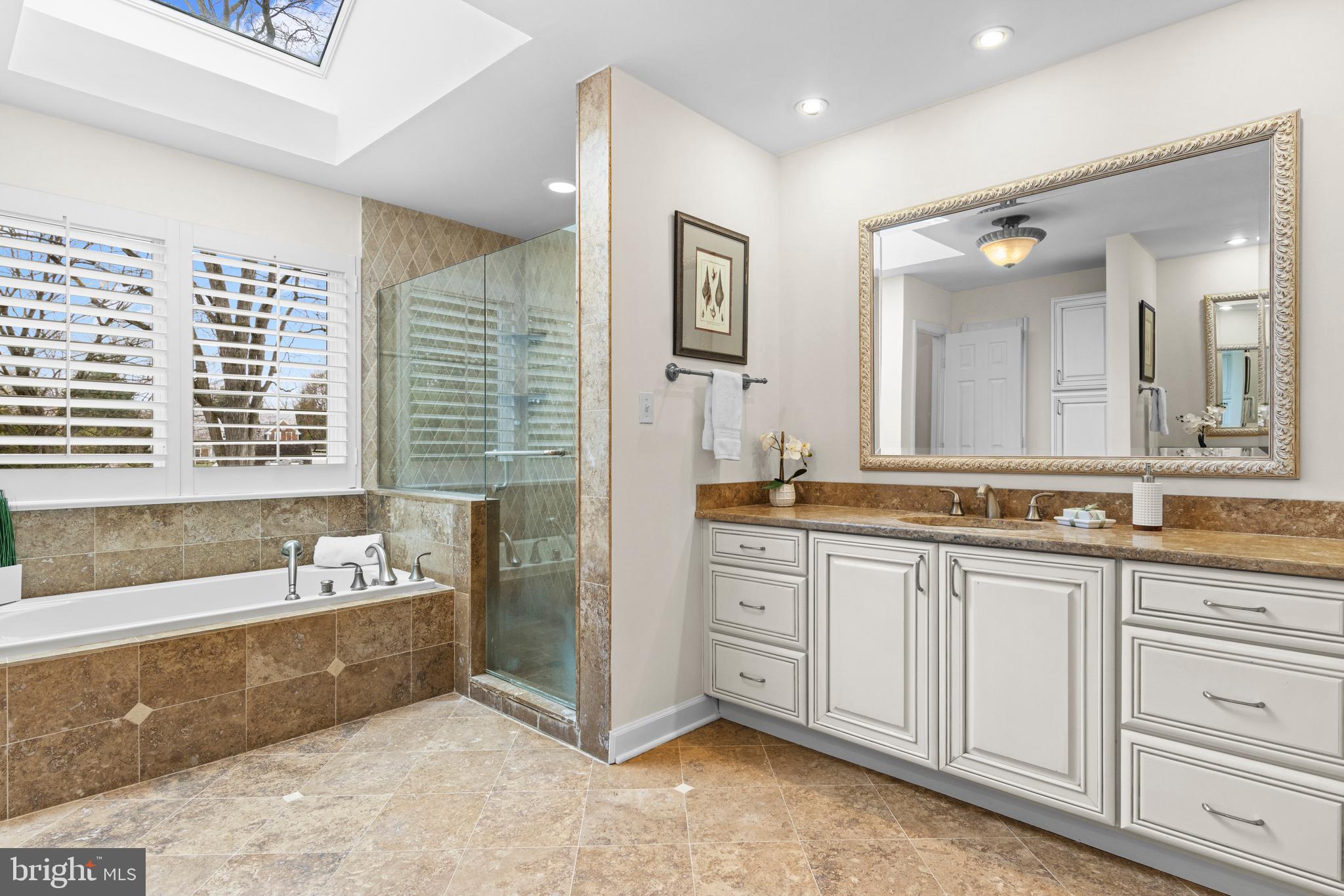 217 Ravenscliff Road Wayne, PA 19087 - Photo 51 of 64 Nicely tiled primary bath w/ 2 oversized vanities