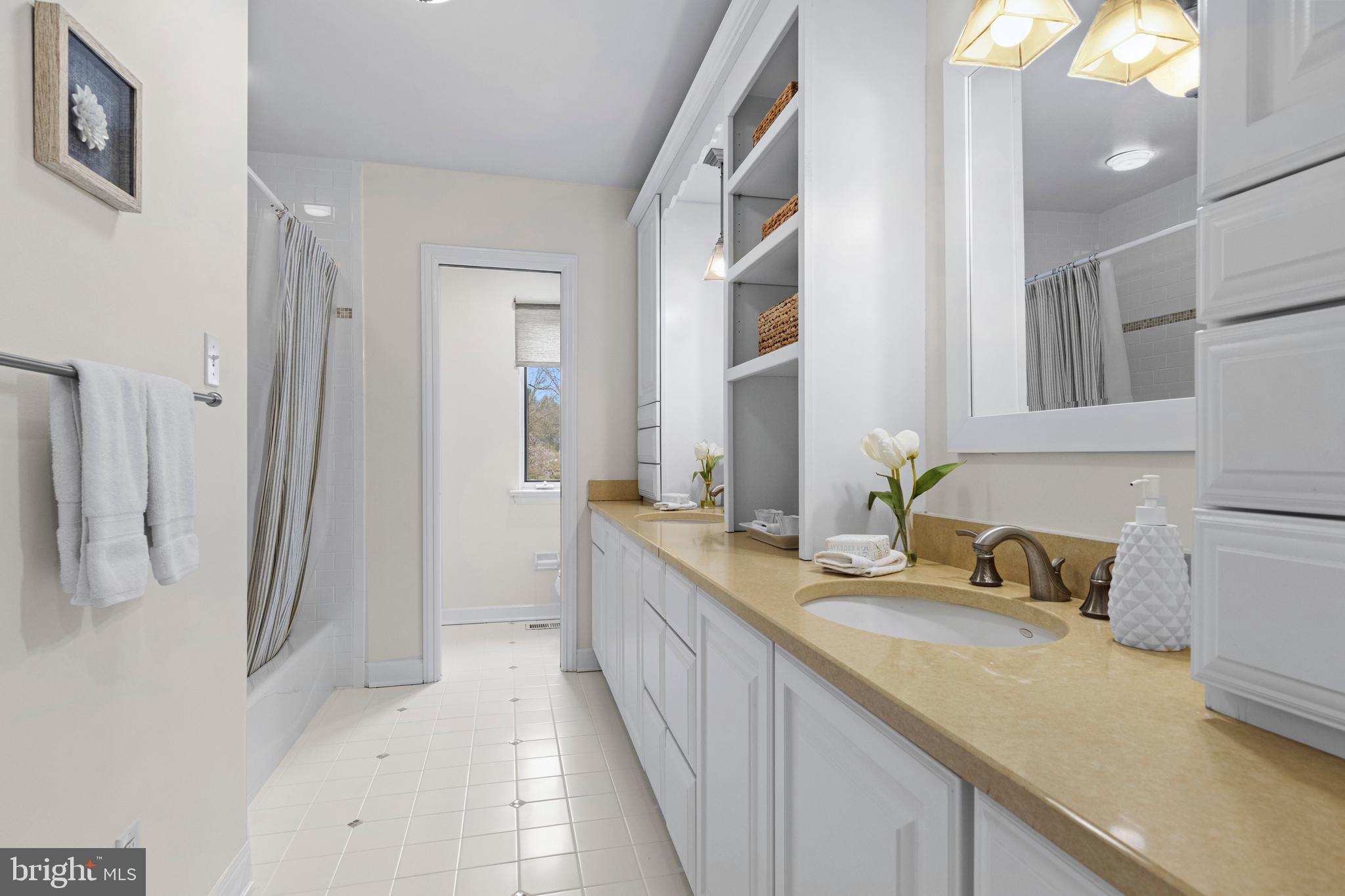 217 Ravenscliff Road Wayne, PA 19087 - Photo 55 of 64 Hall bath with great cabinetry and tub/shower