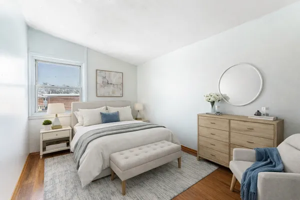 a bedroom with a bed and furniture