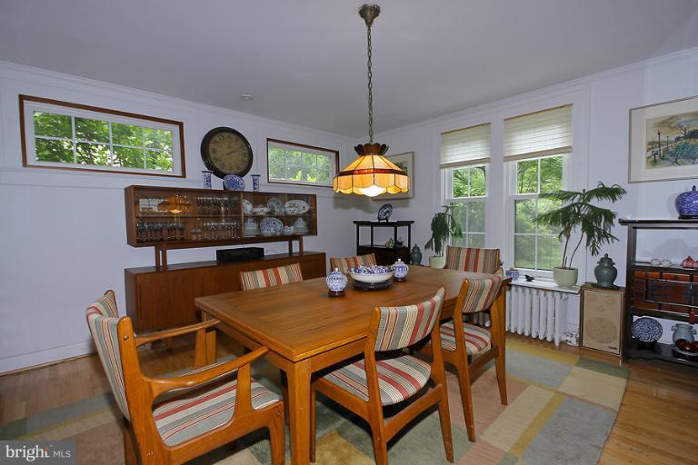 2105 Hanover Street Silver Spring, MD 20910 - Photo 12 of 23 a dining room with a wooden table and chairs