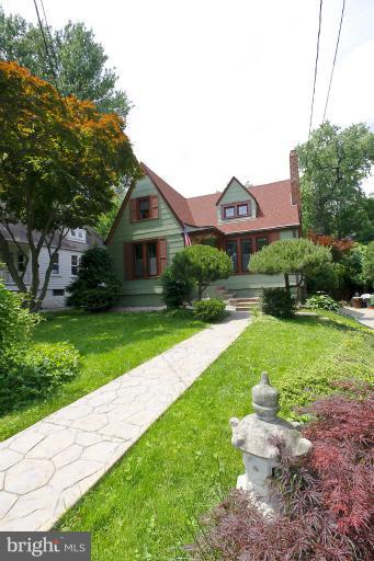 2105 Hanover Street Silver Spring, MD 20910 - Photo 18 of 23 a front view of a house with a yard and garage