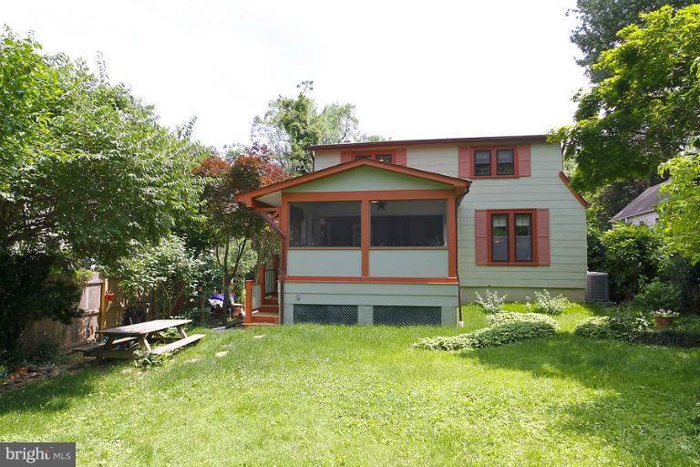 2105 Hanover Street Silver Spring, MD 20910 - Photo 19 of 23 a front view of a house with a garden and yard