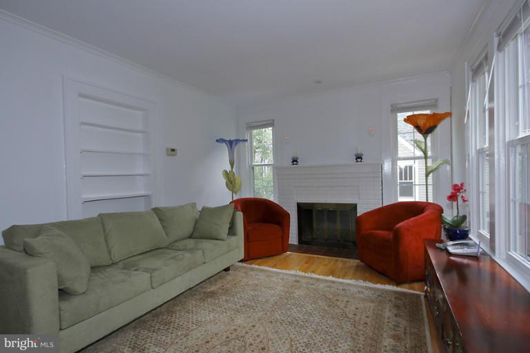 2105 Hanover Street Silver Spring, MD 20910 - Photo 22 of 23 a living room with furniture and a fireplace