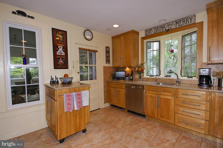 2105 Hanover Street Silver Spring, MD 20910 - Photo 4 of 23 a large kitchen with kitchen island granite countertop a large window