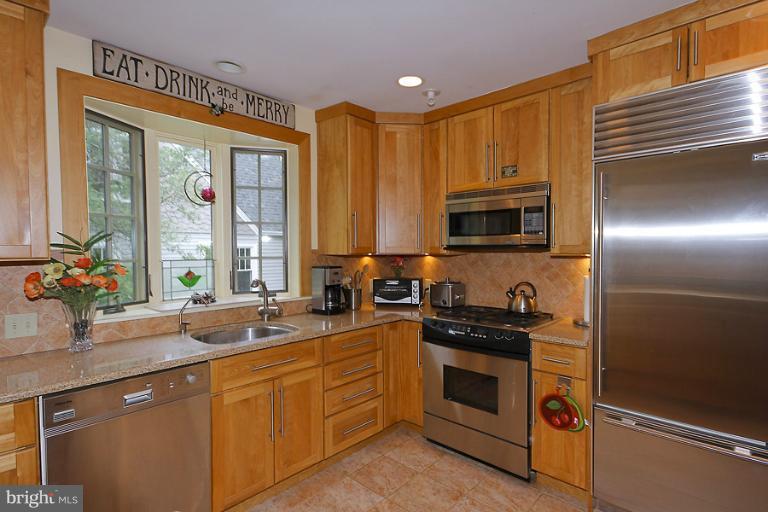 2105 Hanover Street Silver Spring, MD 20910 - Photo 8 of 23 a kitchen with stainless steel appliances a stove sink and microwave