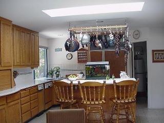 8900 Chalk Hill Road Healdsburg, CA 95448 - Photo 6 of 11 a kitchen with a table and chairs