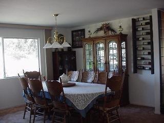 8900 Chalk Hill Road Healdsburg, CA 95448 - Photo 8 of 11 a view of a dining room with furniture window and wooden floor