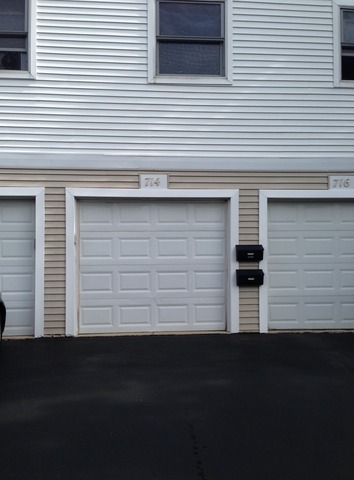 714 Inverrary Lane Deerfield, IL 60015 - Photo 15 of 17 a front view of a house with a garage
