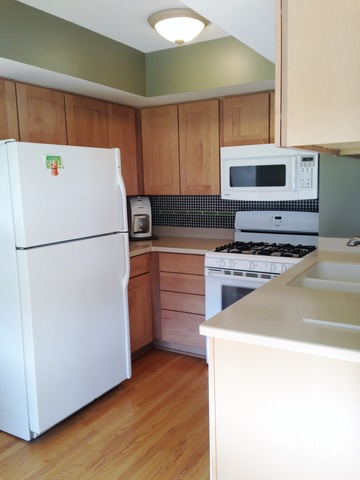 714 Inverrary Lane Deerfield, IL 60015 - Photo 3 of 17 a kitchen with a refrigerator and a stove