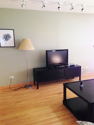 714 Inverrary Lane Deerfield, IL 60015 - Photo 8 of 17 a living room with furniture and a flat screen tv