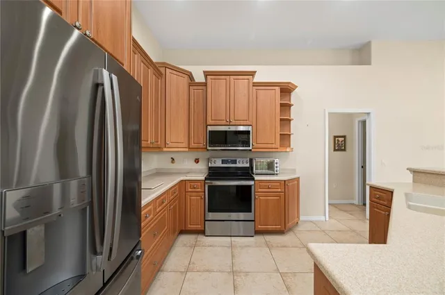 a living room with furniture fireplace and large windows