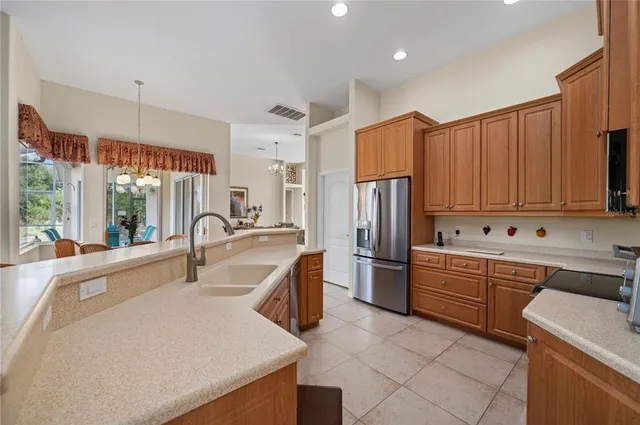 a living room with furniture and kitchen view