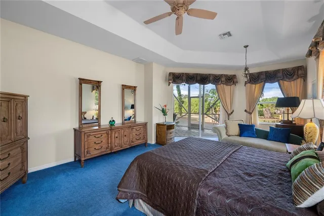 a spacious bathroom with a granite countertop tub sink and mirror