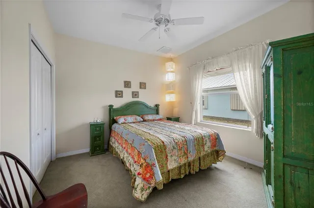 a view of an outdoor dining space with a table and chairs