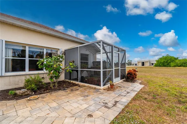an aerial view of a residential houses with outdoor space
