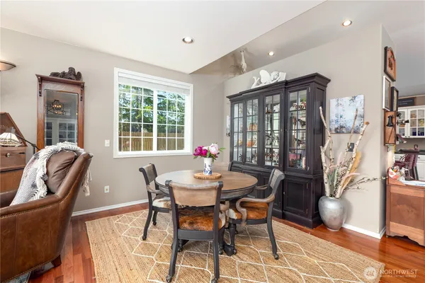 a dining room with furniture and window