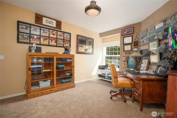a view of a workspace with furniture