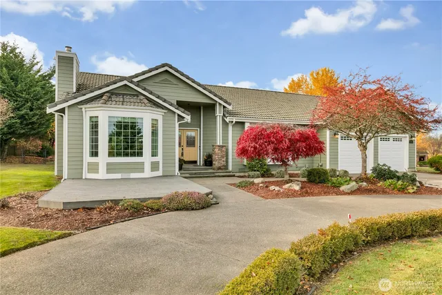 a front view of a house with yard