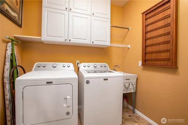 a utility room with dryer and washer