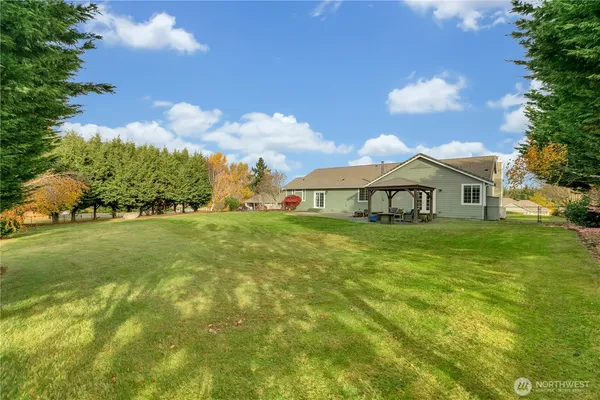 a front view of house with yard and green space