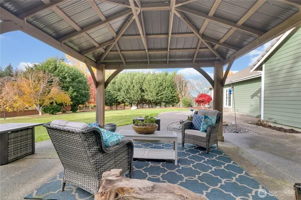 a patio with yard table and chairs