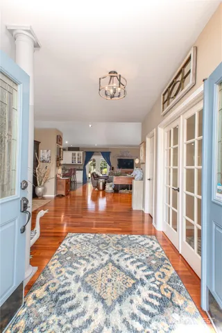 a view of a living room with kitchen