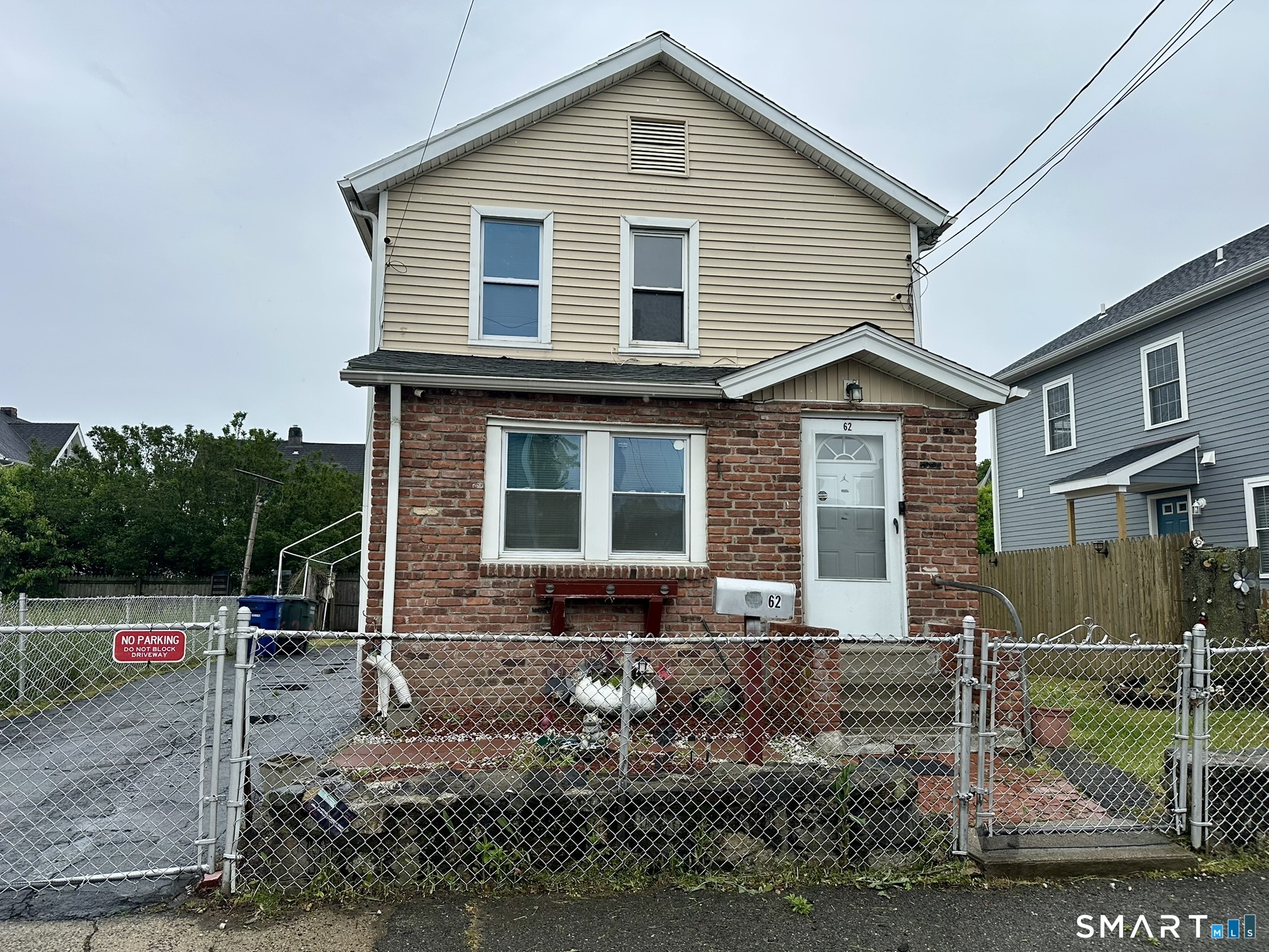 62 Clifford Street Bridgeport, CT 06607 - Photo 1 of 1 a front view of a house with garden