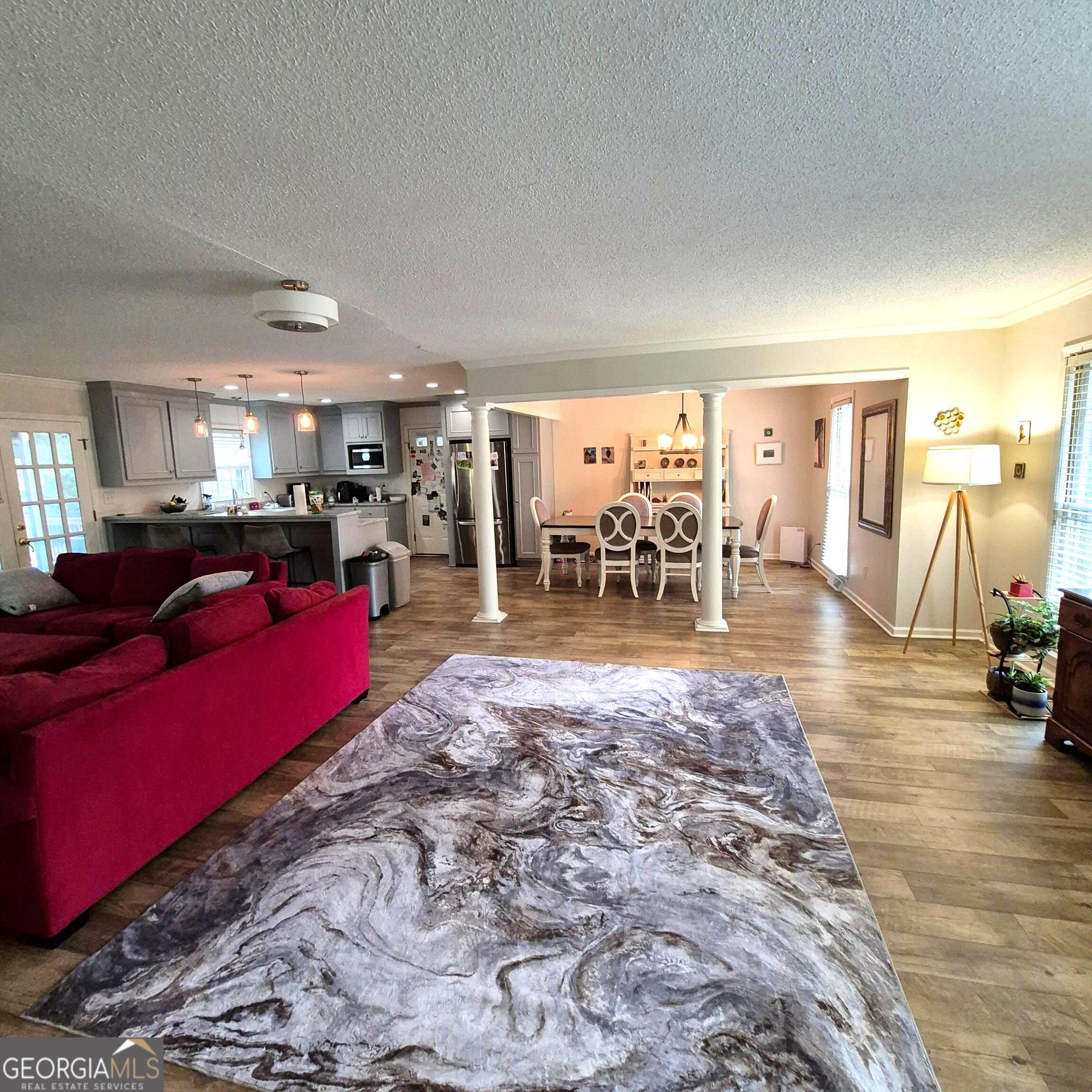 930 Hill Place Macon, GA 31210 - Photo 13 of 34 a living room with furniture and a dining table with kitchen view