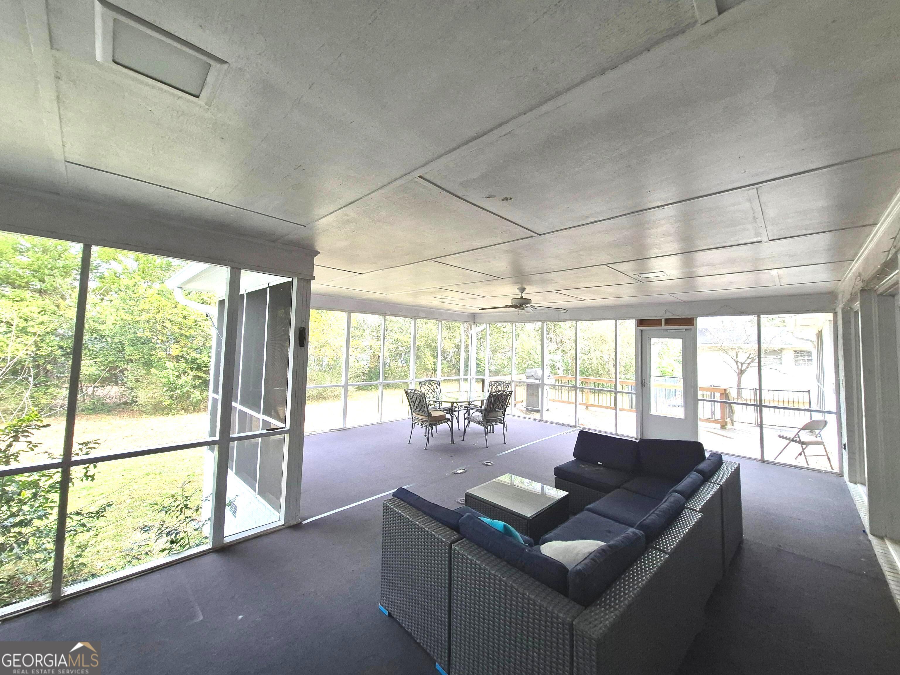 930 Hill Place Macon, GA 31210 - Photo 16 of 34 a living room with furniture and large windows