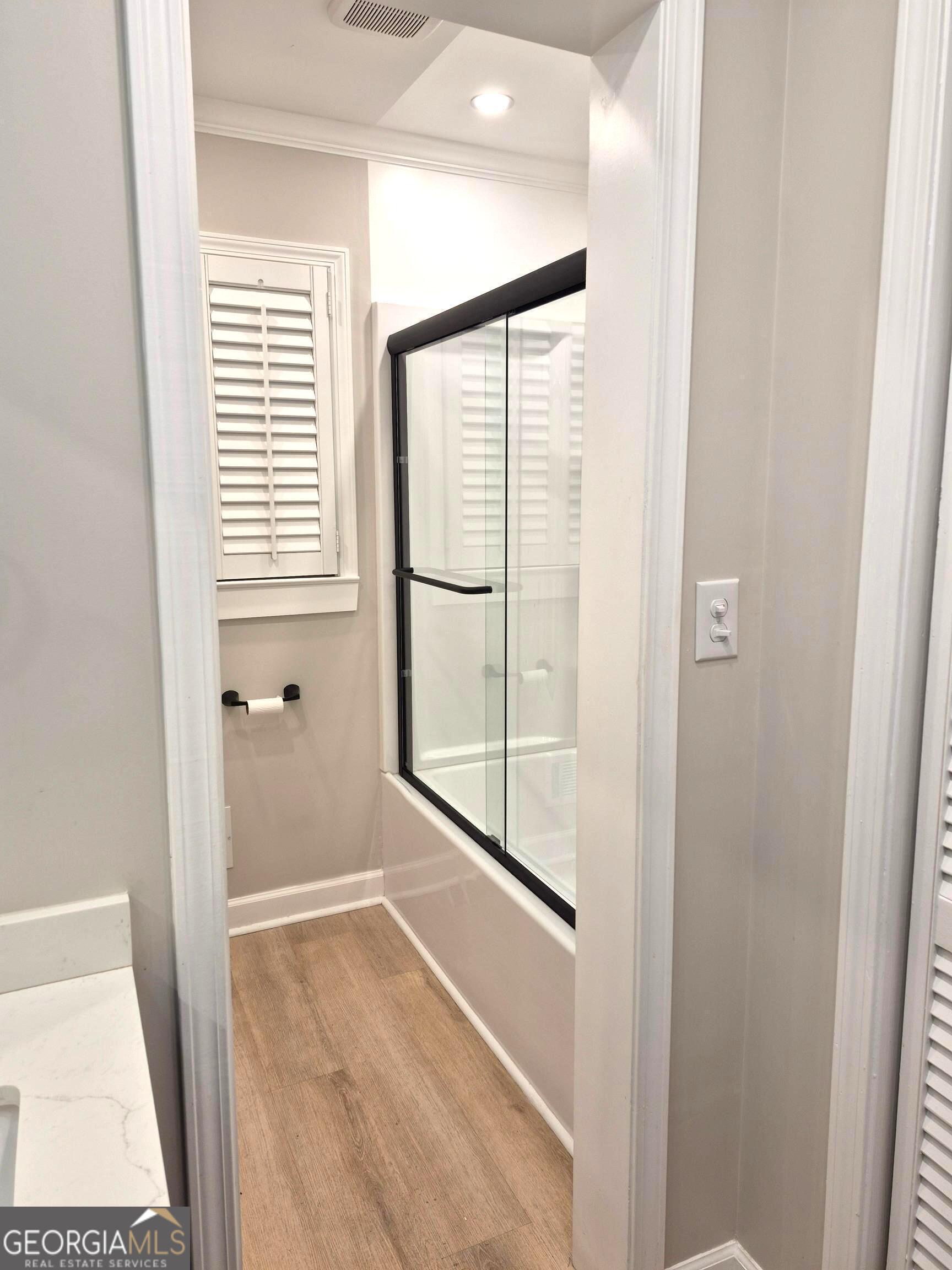 930 Hill Place Macon, GA 31210 - Photo 21 of 34 a bathroom with a glass shower door