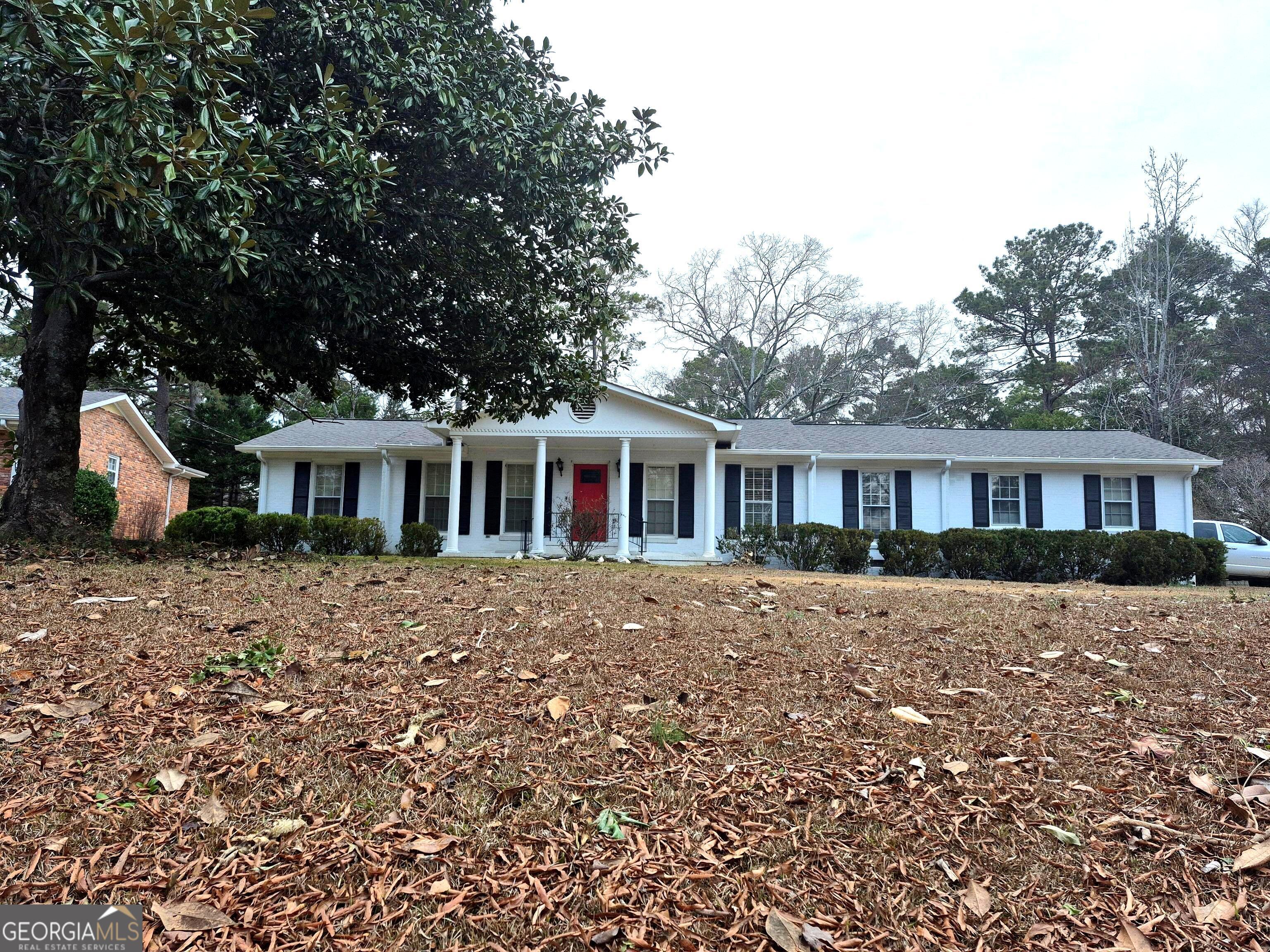 930 Hill Place Macon, GA 31210 - Photo 3 of 34 a front view of a house with yard porch and furniture