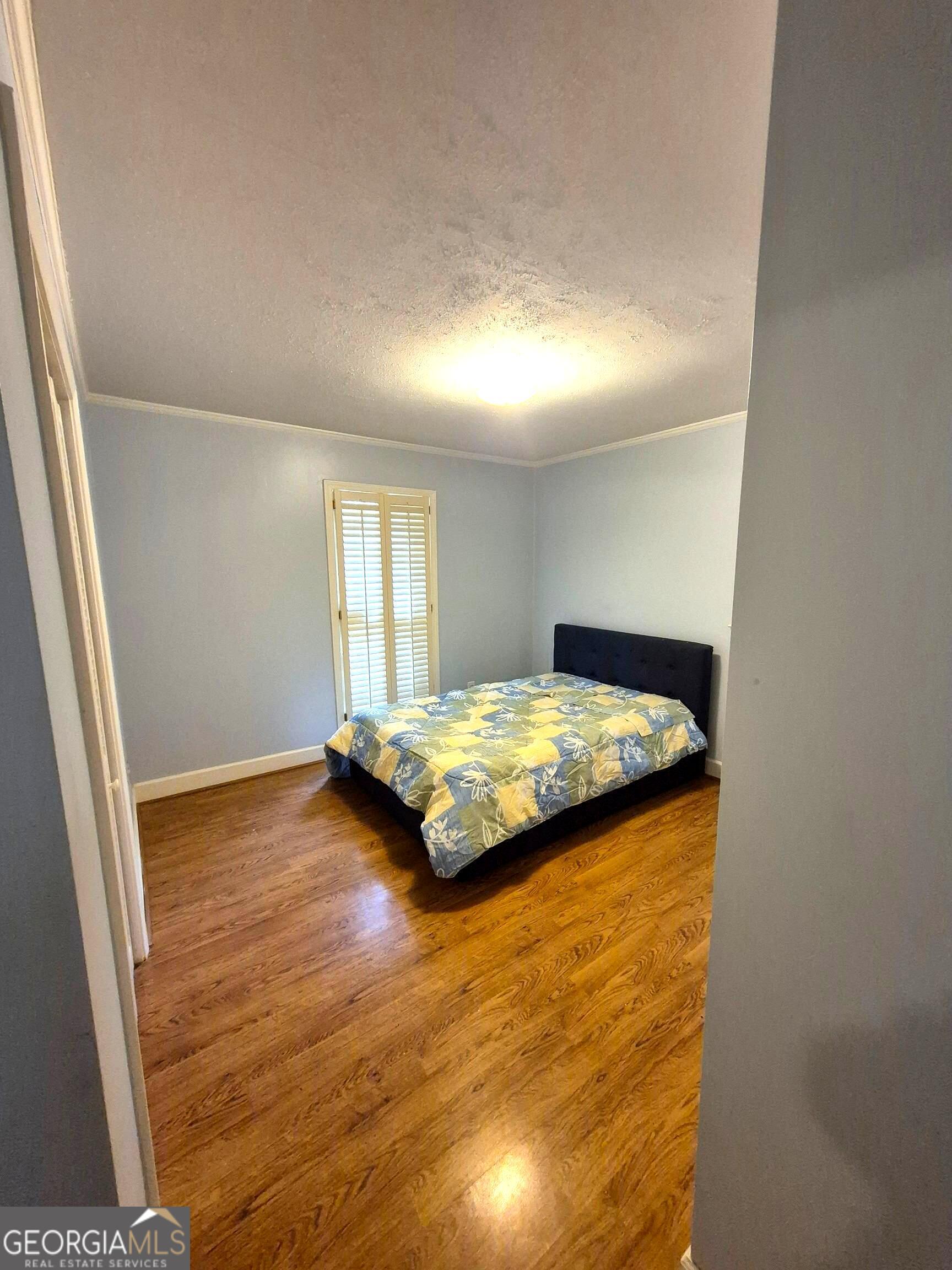 930 Hill Place Macon, GA 31210 - Photo 32 of 34 a bedroom with a bed and a window