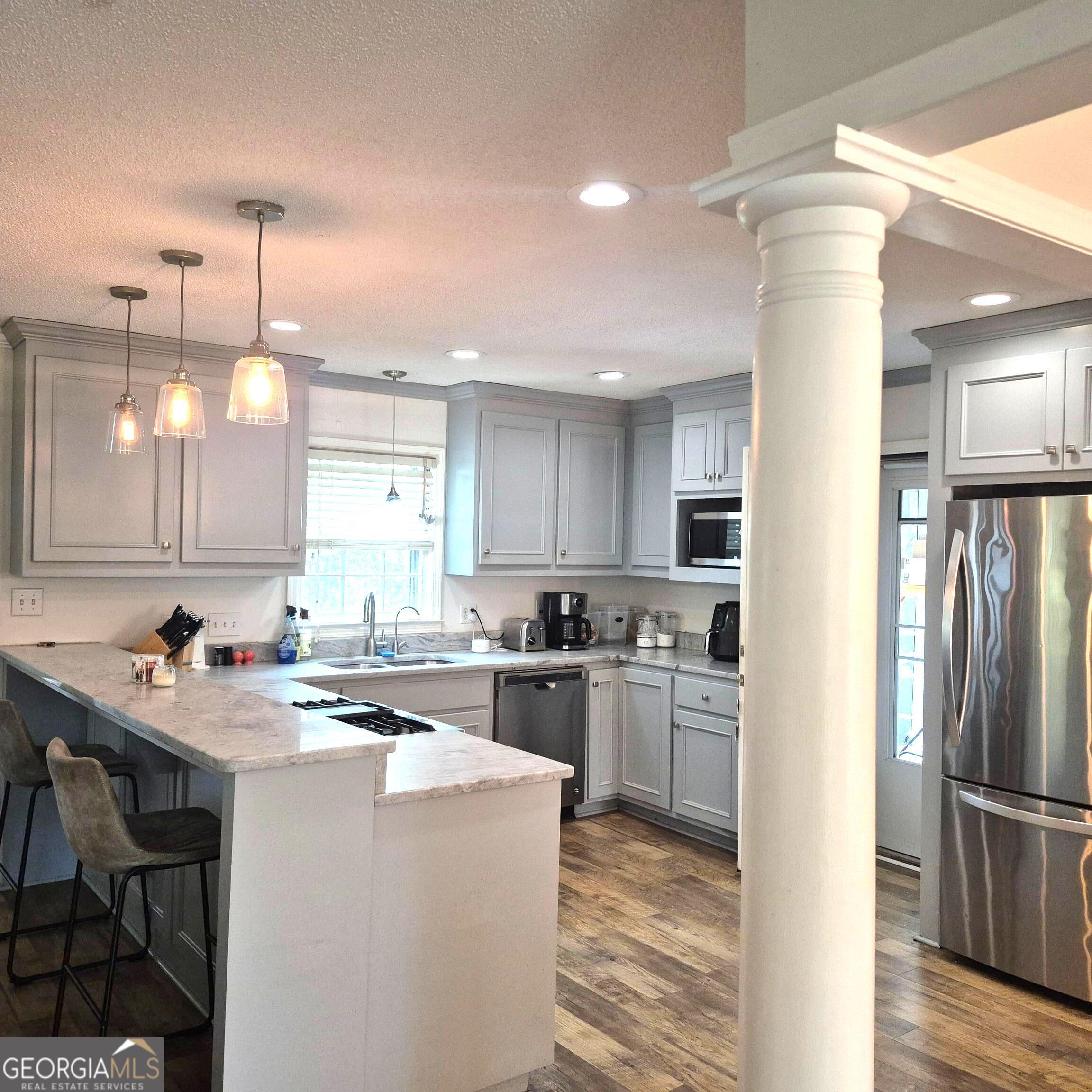 930 Hill Place Macon, GA 31210 - Photo 10 of 34 a kitchen with refrigerator and cabinets