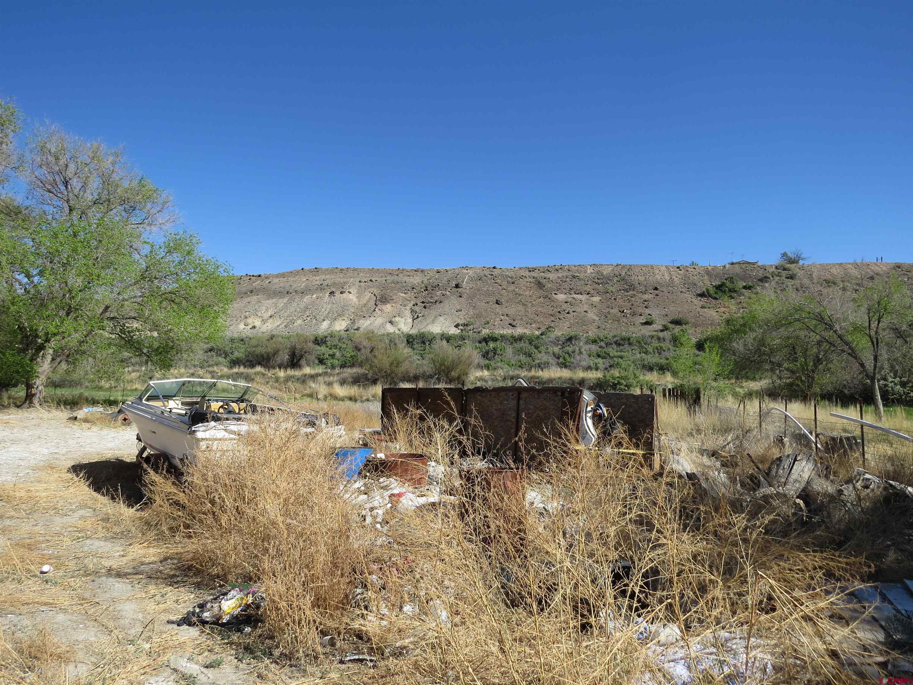 22203 Canal Street Austin, CO 81410 - Photo 19 of 20 a view of a lake with a mountain in the background